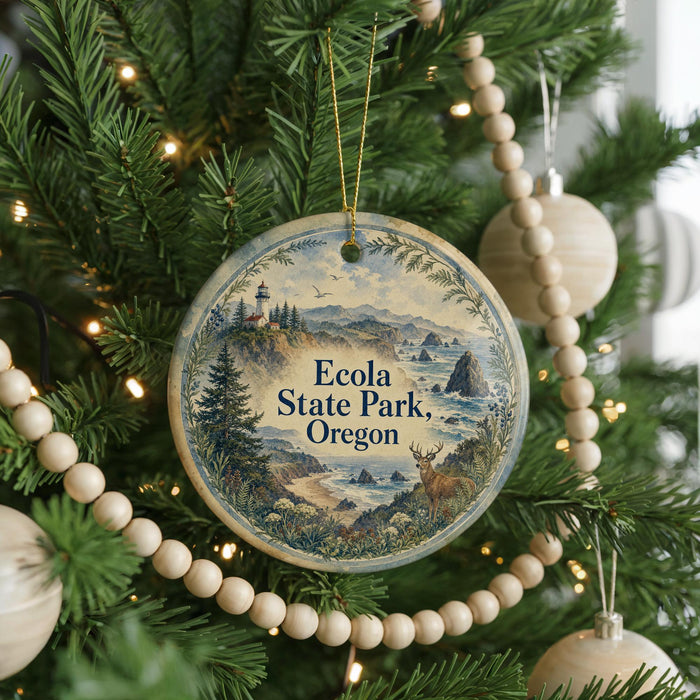 A round ornament hanging on a Christmas tree, featuring a scenic landscape with mountains, a lighthouse, and a body of water.