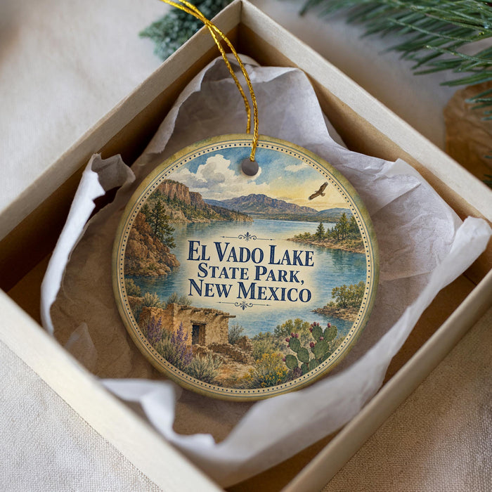 A decorative ornament with a scenic landscape of El Vado Lake, State Park, New Mexico, featuring mountains, a lake, and a bird in flight.