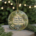 A round ornament with a scenic image of Eno River State Park, North Carolina, featuring a river, trees, and a bridge.