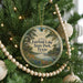A circular ornament hanging on a Christmas tree, featuring a scenic landscape of Fairfield Lake State Park, Texas.