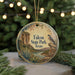 A round ornament with a bird perched on a rock, surrounded by a landscape of mountains, trees, and a river, with the text "Falcon State Park, Texas" displayed prominently.
