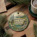 A decorative ornament with a scenic landscape of a mountain, pine trees, and a stream, featuring the text "Fields Spring State Park, Washington".