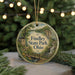 A round ornament with a scenic landscape of Findley State Park, Ohio, featuring a bridge, waterfall, and trees.