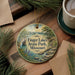 A decorative ornament with a scenic landscape of Finger Lakes State Park, Missouri, featuring a waterfall and pine trees.