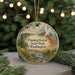 A round ornament with a scenic landscape of Flaming Geyser State Park, Washington, featuring a river, mountains, and pine trees.