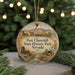 A round ornament with a picture of Fort Churchill, the historic State Historic Park in Nevada, surrounded by Christmas lights and greenery.