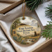 A decorative ornament with a picture of Fort Leaton, a historic site in Texas, hanging from a string.