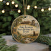 A round ornament with a painting of Fort Leaton, a historic site in Texas, featuring a wagon and a building.