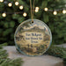 A round ornament with a picture of Fort McKavet, a historic site in Texas, hanging from a string.