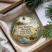 A decorative ornament with a painting of Fort Sisset Historic State Park, South Dakota, featuring a buffalo, a teepee, and a river.