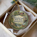 A decorative ornament in a box, featuring illustrations of a pond, a bird, and a deer, with the text "French Creek State Park, Pennsylvania" printed on it.