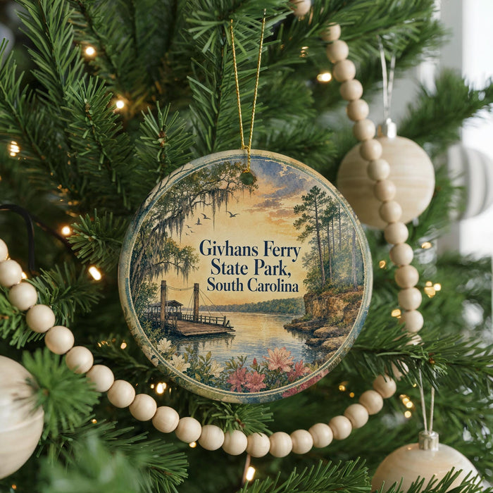 A round ornament hanging on a Christmas tree, featuring a scenic image of Givhan's Ferry State Park in South Carolina.