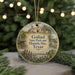 A circular ornament with a picture of a historic site, specifically Goliad State Park and Historic Site, Texas, hanging from a string.