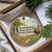 A decorative ornament with a scenic landscape of Good Earth State Park, South Dakota, featuring a bison in the foreground and a waterfall in the background.