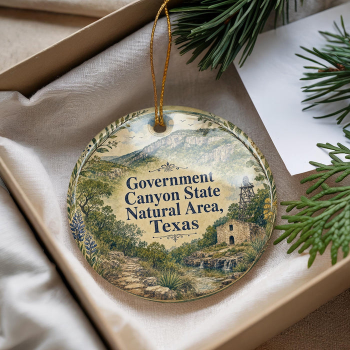 A decorative ornament with a scenic image of the Government Canyon State Natural Area in Texas, hanging from a string.
