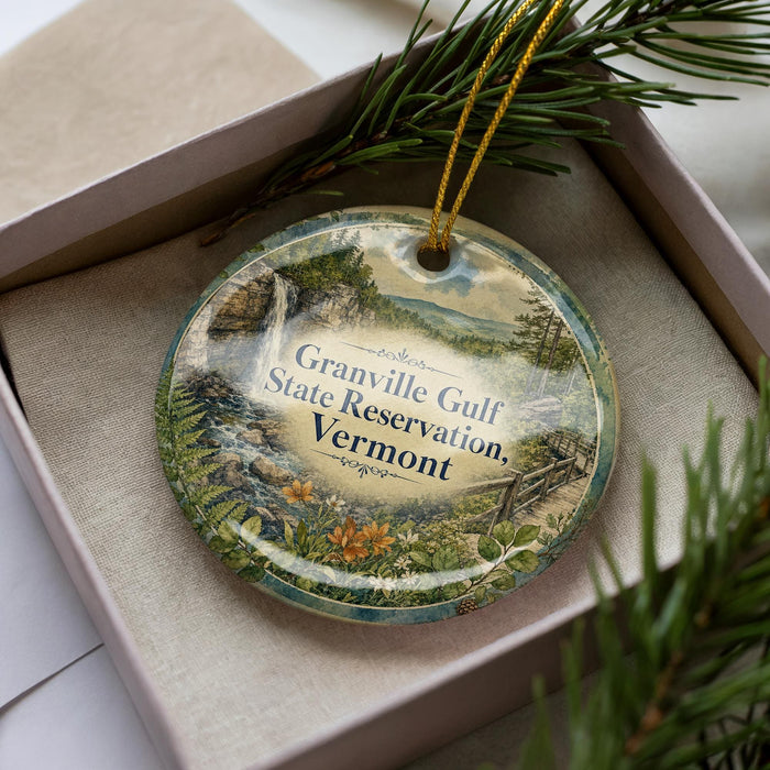 A decorative ornament with a scenic landscape of Granville Gulf State Reserve, Vermont, featuring a waterfall and pine trees.