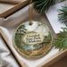A decorative ornament with a scenic landscape of Greenleaf State Park, Oklahoma, featuring a lake, mountains, and a cabin.