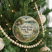 A round ornament hanging on a Christmas tree, featuring a scenic image of Guilford Lake State Park, Ohio.