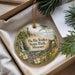 A decorative ornament with a scenic landscape of Ha Tonka State Park, Missouri, featuring a castle, waterfall, and greenery.