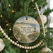 A round ornament hanging on a Christmas tree, featuring a scenic image of Hampton Beach State Park in New Hampshire.