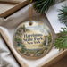 A decorative ornament with a scenic landscape of Harriman State Park, New York, featuring a bridge, trees, and a waterfall.