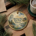 A decorative ornament featuring a scenic landscape of Harrison Bay State Park in Tennessee, with a cabin and a lake in the background.