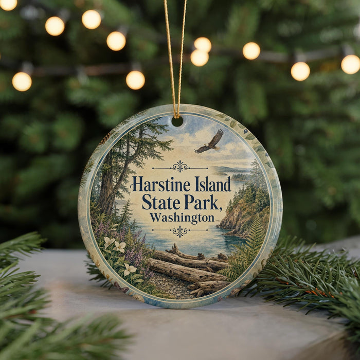 A circular ornament with a scenic image of Harstine Island State Park, Washington, featuring a bird in flight and a forest landscape.