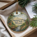 A decorative ornament with a scenic image of Hartman Creek State Park, Wisconsin, featuring a deer, a canoe, and pine trees.