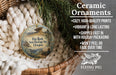 Ceramic ornaments, featuring a round ornament with a scenic image of the Hat Rock State Heritage Site in Oregon, hanging in a woven basket.
