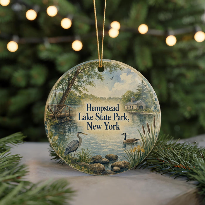 A round ornament featuring a scenic view of Hempstead Lake State Park, New York, with a bird and a duck in the foreground and a bridge in the background.