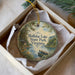 A round ornament with a scenic image of Holliday Lake State Park, Virginia, hanging from a string.