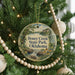 A round ornament hanging on a Christmas tree, featuring a scenic image of Honey Creek State Park in Oklahoma.