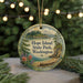 A round ornament with a scenic landscape of Hope Island State Park, Washington, featuring a lake, pine trees, and a beach.