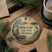 A decorative ornament featuring a scenic landscape with a lake, boat, and birds, along with the text "HUGO LAKE STATE PARK, OKLAHOMA".