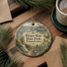 A decorative ornament featuring the image of Hyner Run State Park in Pennsylvania, surrounded by pine branches and a cup of coffee on a wooden surface.