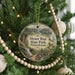 A round ornament hanging on a Christmas tree, featuring a scenic image of Hyner Run State Park, Pennsylvania.