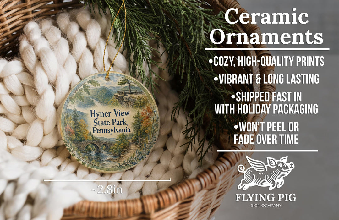 Ceramic ornaments, featuring a detailed image of Hyner View State Park, Pennsylvania, hanging from a wicker basket.