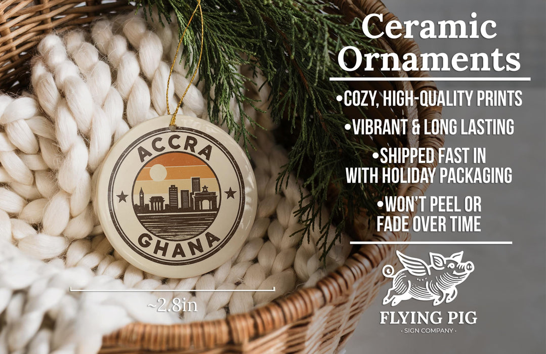 Ceramic ornaments, featuring a ceramic ornament with a city skyline design, are displayed in a woven basket.