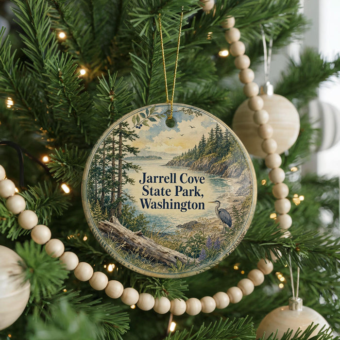 A circular ornament hanging on a Christmas tree, featuring a scenic landscape with a lake, trees, and a bird.