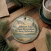 A round ornament with a scenic landscape of Johnson Lake, State Recreation Area, Nebraska, featuring a lake, mountains, pine trees, and a picnic table.