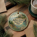 A decorative ornament featuring a lighthouse and a scenic landscape, with the text "Kelley's Island State Park, Ohio" prominently displayed.