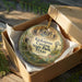 A decorative ornament in a wooden box, featuring a scenic image of the Kickapoo Canyon State Park, Texas.