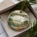 A decorative ornament in a box, featuring an illustration of the Kinzua Bridge in Pennsylvania.
