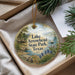 A decorative ornament with a scenic image of Lake Arrowhead State Park, Texas, featuring a cabin, a sailboat, and a landscape with mountains and trees.