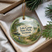 A decorative ornament with a scenic landscape of Lake Carmi State Park, Vermont, featuring a path, a boat, and pine trees.