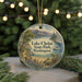 A circular ornament with a scenic landscape of Lake Chelan State Park, Washington, featuring a lake, mountains, and a boat on the water.
