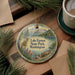 A decorative ornament featuring a scenic landscape of Lake Easton State Park in Washington, with a canoe on the water and pine trees in the background.