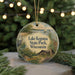 A round ornament with a scenic image of Lake Kegonsa State Park, Wisconsin, featuring a bird, a house, and a boat on the water.