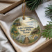 A decorative ornament with a scenic landscape of Lake Livingston State Park, Texas, featuring a bird, a cabin, and a body of water.