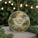 A decorative ornament featuring a scenic view of Lake Livingston State Park in Texas, with a lake, trees, and a boat on the water.
